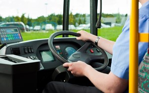 a bus driver driving a bus