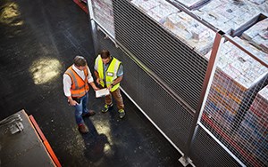 two people consulting in a warehouse