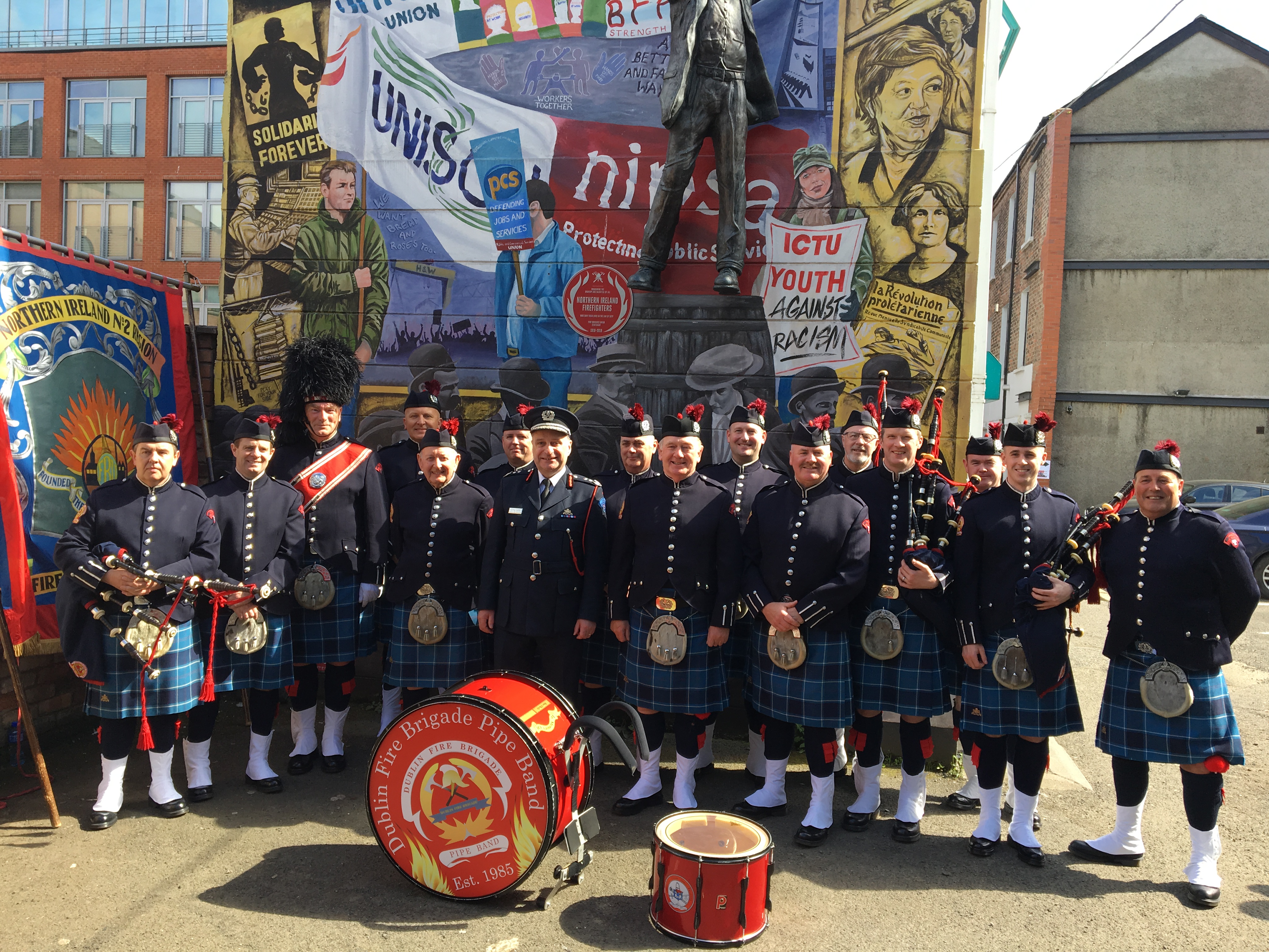 a group of people in kilts