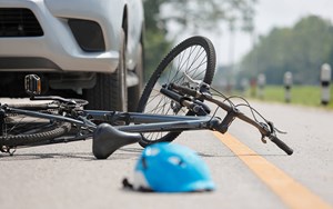 Bicycle and helmet lay in the road
